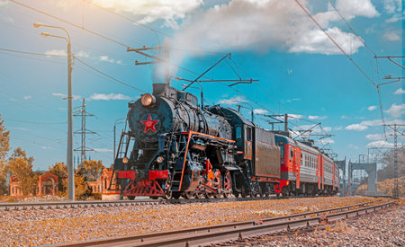 A vintage steam locomotive at dawn. Retro travel