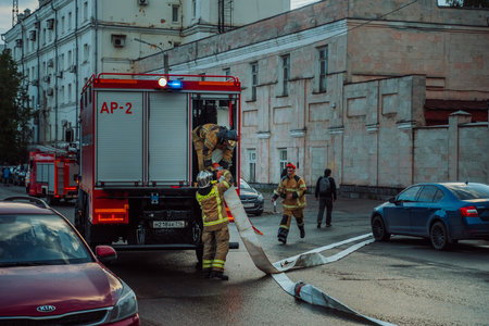 Kazan, Tatarstan. May 26, 2022. Fire brigade has come out for a fire in the city. Firefighters connect the fire hoseのeditorial素材