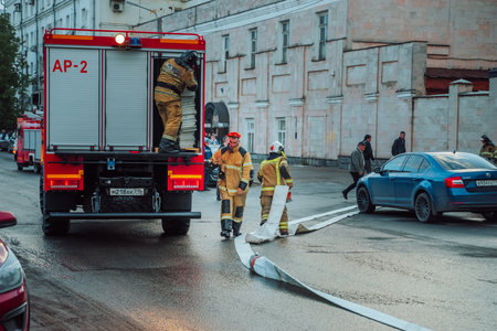 Kazan, Tatarstan. May 26, 2022. Fire brigade has come out for a fire in the city. Firefighters connect the fire hoseのeditorial素材