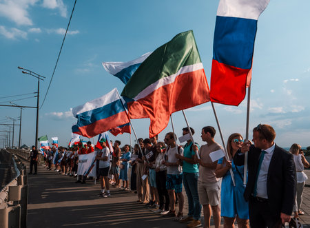 Kazan, Russia. 2022, 12 June. Festive procession with flags of Russia and Tatarstanのeditorial素材