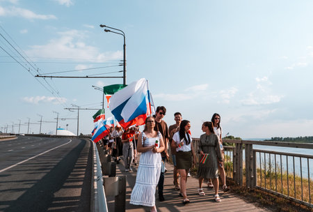 Kazan, Russia. 2022, 12 June. Festive procession with flags of Russia and Tatarstanのeditorial素材