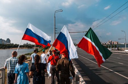 Kazan, Russia. 2022, 12 June. Festive procession with flags of Russia and Tatarstanのeditorial素材