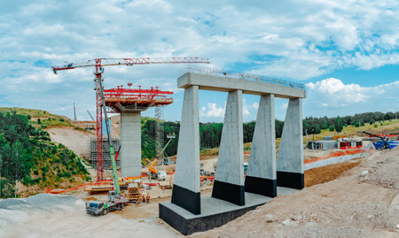 Constructing concrete pillars of the bridge. Construction of the new M12 highwayの写真素材