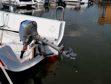 A view of the stern of a yacht with an outboard motor.の写真素材