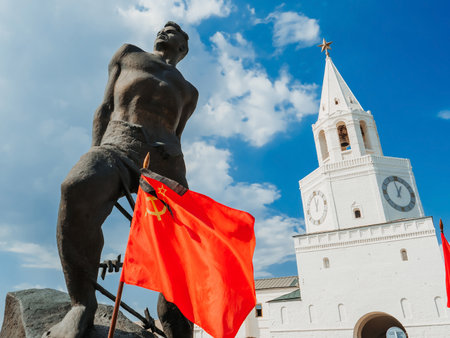 Monument to Tatar poet Musa Dzhalil near the Kazan Kremlin. The flag of the Soviet Union and the tower with the star.のeditorial素材