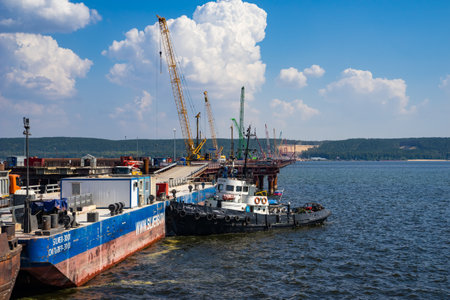 The tug is moored around the barge.のeditorial素材