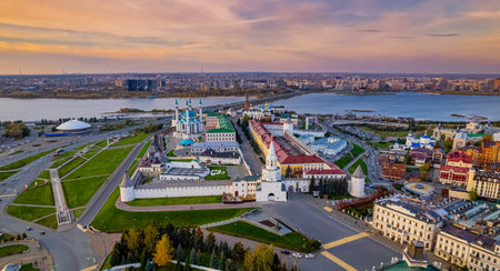 A view of the Kazan Kremlin with the Qul Sharif Mosque, Preobrazhensky Cathedral and Suyumbike Tower. Spasskaya Tower - the main entrance to the Kremlin. Cityscape with the Kazanka River at sunsetの写真素材