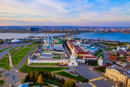 A view of the Kazan Kremlin with the Qul Sharif Mosque, Preobrazhensky Cathedral and Suyumbike Tower. Spasskaya Tower - the main entrance to the Kremlin. Cityscape with the Kazanka River at sunsetの写真素材