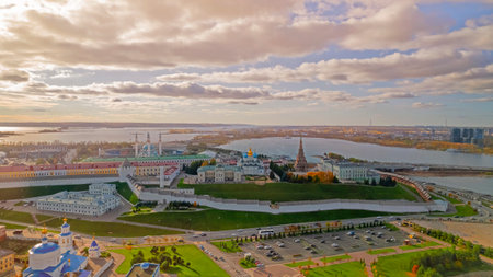A view of the Kazan Kremlin with the Qul Sharif Mosque, Preobrazhensky Cathedral and Suyumbike Tower. Spasskaya Tower - the main entrance to the Kremlin. Cityscape with the Kazanka River at sunsetの写真素材
