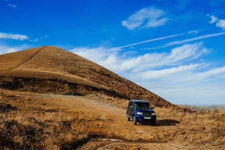 Russian SUV UAZ Patriot or UAZ 3163. Extreme mountain safari. Sollers automotive group. Test drive a new car in the mountains.のeditorial素材