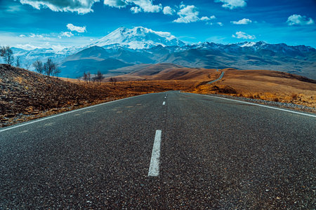The road leading up to the mountain. Beautiful mountain scenery. Road close-up.