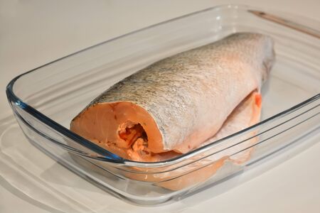 Purified fish for cooking in a glass tray.の写真素材