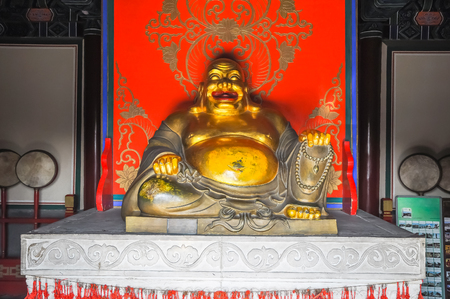 God of happiness Hotei in the temple.の写真素材