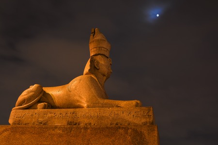 Ancient Egyptian sphinx sculpture against the night sky.の写真素材