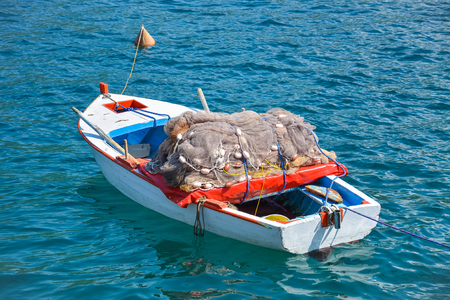 Beautiful fishing boat with a large fishing net in it.の写真素材