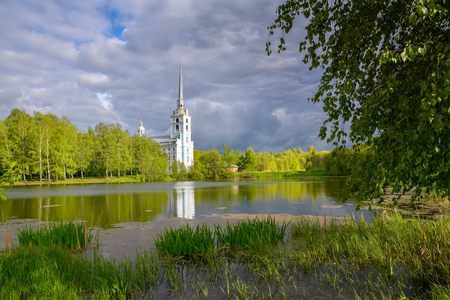Spring landscape - Church on the lake. Russia.の写真素材