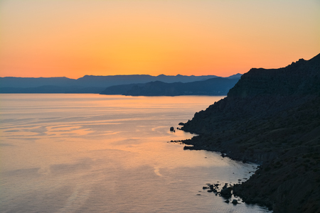 Rocky coast of the Black Sea in the sunset.の写真素材
