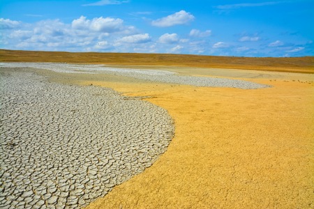 Dried and cracked soil in the valley of mud volcanoes.の写真素材