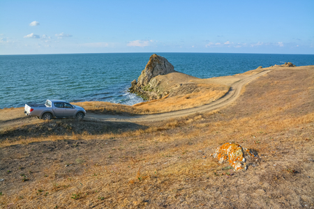 Off-road car rides along the shore of Azov sea.の写真素材