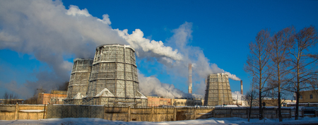Panorama of a cement plant with smoking pipes.の写真素材