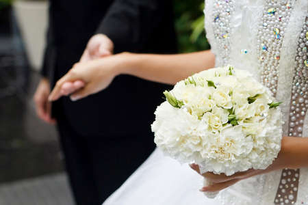 the bride's bouquet of white roses.の写真素材