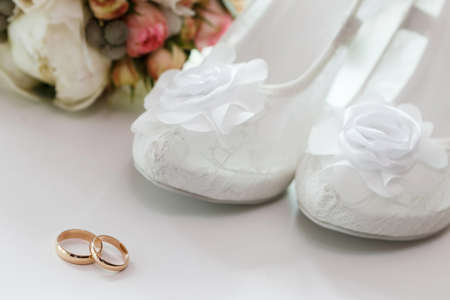 wedding rings and bridesmaid shoesの写真素材