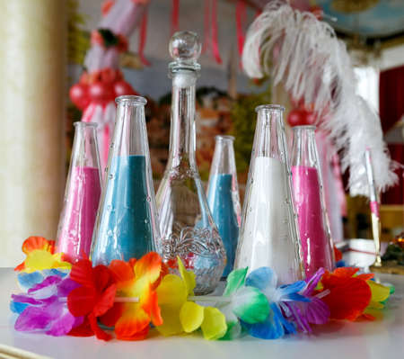 vessels with colored sand for sand ceremony