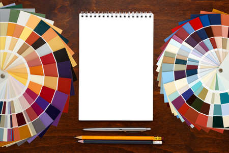 Color palette guide on the wooden background and notepad. mockup, template