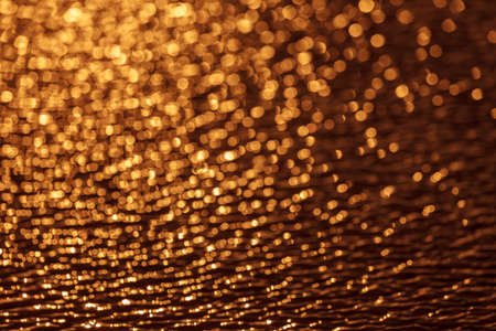 the glare on the water, Golden bokehの写真素材