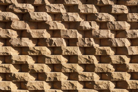 structural wall made of rough natural stoneの写真素材
