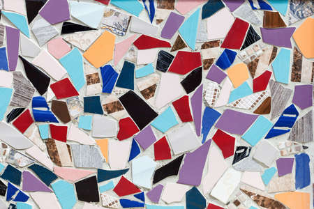 the wall is decorated with pieces of ceramic tileの写真素材