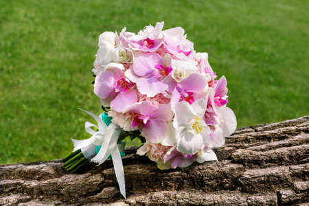 beautiful Bridal bouquet of white and pink orchidsの写真素材