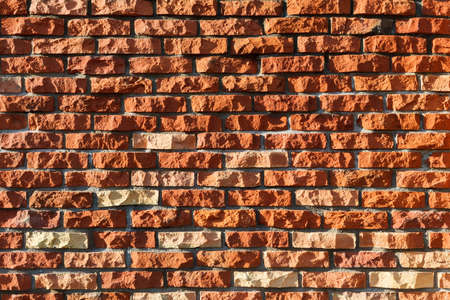 wall made from chopped red ceramic bricks
