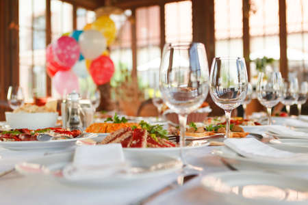 Serving table prepared for event party or wedding. Soft focus, selective focus