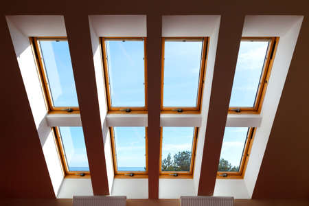 Construction of eight attic windows. Large, luxury skylights. Roof windowsの写真素材