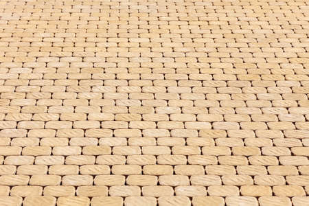 Pavement of yellow paving slabs. The background image textureの写真素材