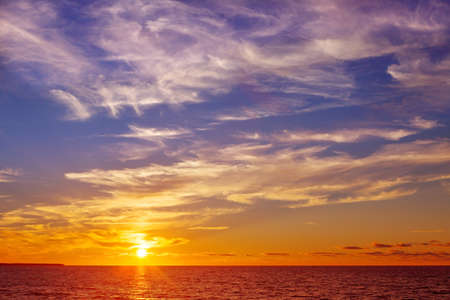 Beautiful marine sunset with orange Cirrus clouds
