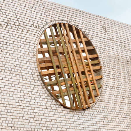 White silicate brick wall And wooden formwork for round window.の写真素材
