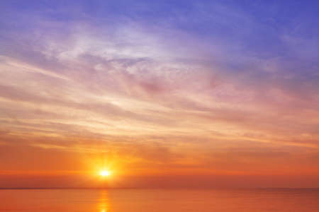 Beautiful, orange-pink sunset over the sea. Background image