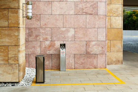 The designated smoking area is indicated by the yellow line. Sentosa Island, Singapore