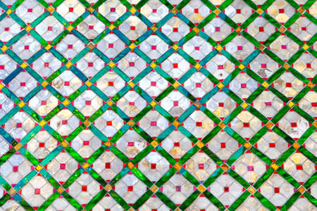 Wall pattern of mirrors and colored glass of Wat Phra Kaew, Grand Palace, Bangkok, Thailand, Asia