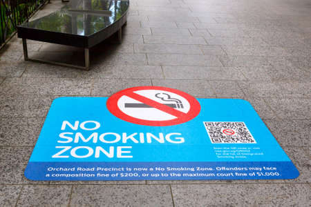 SINGAPORE-November 28, 2019: Sign no smoking zone on the sidewalk Orchard Road, Singapore