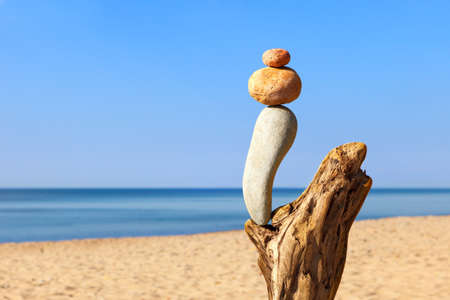 Balance pebbles on the clear blue sky background. Concept of harmony, balance and meditation.