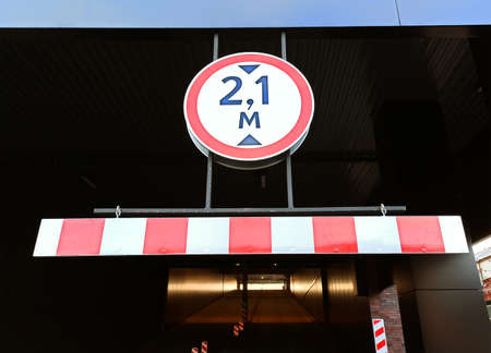 Sign indicating a height limited to two meters ten. Height restriction sign close-up