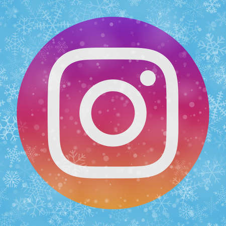 VORONEZH, RUSSIA - NOVEMBER 28, 2020: Instagram logo square icon on Christmas background of snowflakes in light blue colorsのeditorial素材