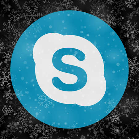 VORONEZH, RUSSIA - NOVEMBER 28, 2020: Skype logo round icon on Christmas background of snowflakes in black colorsのeditorial素材
