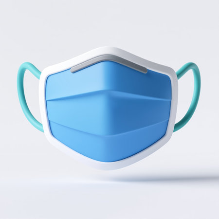 A blue surgical face mask with a white border and teal straps, symbolizing protection against airborne pathogens in a medical setting.の素材