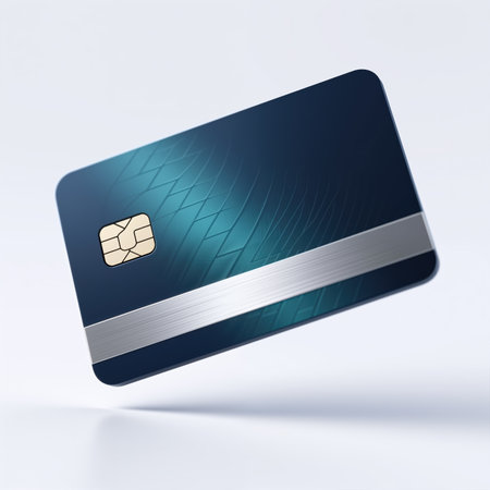A sleek blue credit card with silver stripe and chip, symbolizing modern payment methods, against a clean white background, with a subtle shadow.の素材