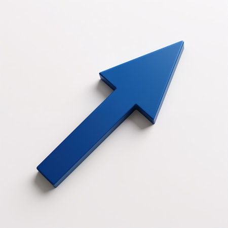 A large blue arrow points up and to the right on a white background, casting a subtle shadow, symbolizing direction and progress.の素材