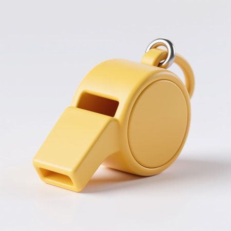 A bright yellow whistle with a silver ring, symbolizing sport, on a plain white background, representing simplicity and focus.の素材